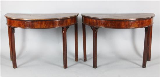 A pair of George III mahogany demi lune side tables, W.3ft 6in. D.1ft 8in. H.2ft 4in.